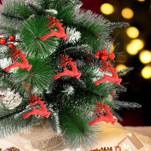 Close-up of red glitter reindeer ornaments hanging on a decorated Christmas tree