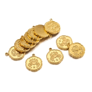 Close-up of golden Cancer zodiac pendants with polished finish and celestial engraving