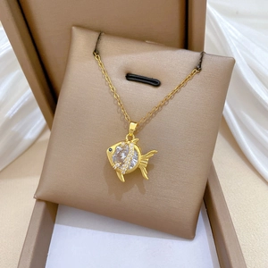 Luxurious gold-plated titanium steel necklace featuring a sparkling zircon goldfish pendant