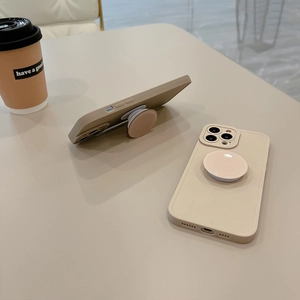 Minimalist beige iPhone case with matte texture and functional pop-out kickstand
