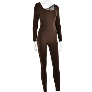 Detailed close-up of brown long sleeve bodysuit with U-neck and elastic fabric texture