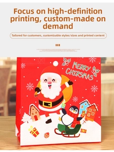 Detail of red Christmas gift bag with Santa Claus cartoon and sturdy handles