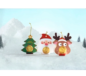 Close-up of Christmas card candy holders with Santa, reindeer and tree designs