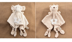 Detail of baby elephant and bear security blankets with star-shaped teether toys