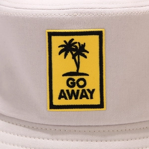 Close-up of GO AWAY embroidery and palm tree patch on twill cotton bucket hat