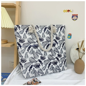 Detailed shot of tropical parrot print canvas tote bag with thick jute rope handles