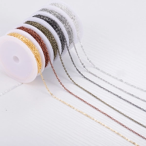 Detail of colorful DIY jewelry making chains on spools in various metallic finishes
