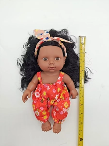 30cm black reborn baby doll with floral red outfit measured by tape on white background