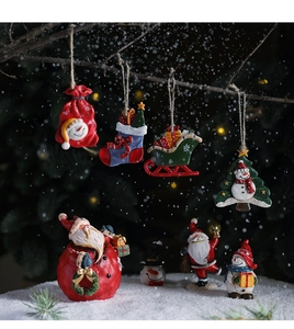 Detailed Christmas resin hanging ornaments featuring Santa and snowman on snowy pine background