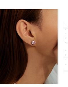 Detailed close-up of 8mm pink rose cut simulated diamond stud earring on model ear