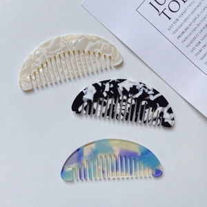 Mini marble acetate wide-tooth hair combs in various artistic patterns for travel