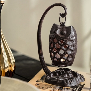 Porte-bougie vintage en fonte en forme de hibou sur support pour décor rustique
