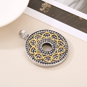 Detailed view of silver and gold circle infinity pendant with crystal rhinestones