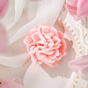 Pink peony shaped handmade soy wax candle on white ceramic tray for Mother's Day gift