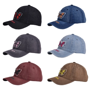 Detailed grid view of six vintage washed denim baseball caps with butterfly embroidery