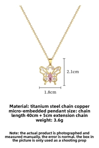 Detailed view of hollow butterfly pendant with pink gem and micro-set zircon stones