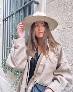 Close-up of beige oversized wool blend shirt jacket with matching flat brim fedora hat