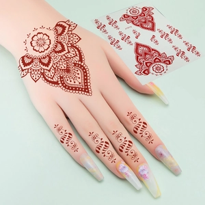 Henna mandala style temporary tattoo sticker in reddish brown for hand and fingers