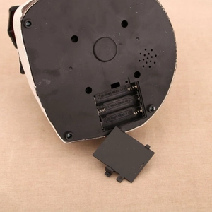 Detail view of the black plastic base with three AA battery compartments for Christmas decor