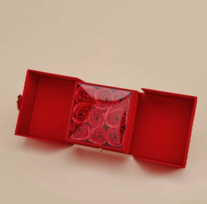 Three-fold open gift box with nine red roses for ring and necklace presentation