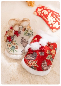 Close-up of traditional Chinese pet vest with jacquard fabric, plush fur trim and pearl buttons
