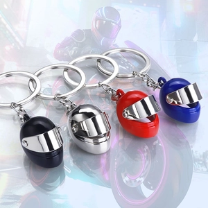 Creative 3D mini motorcycle helmet keychains in black, silver, red, and blue finishes