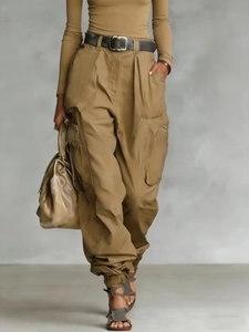 Women high waist wide leg cargo pants in earth tones with pockets and cinched cuffs