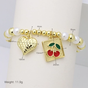 Detailed view of beaded bracelet with 4-6mm pearls, gold heart, and cherry pendants
