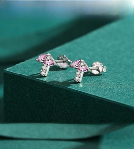 Macro shot of S925 sterling silver mushroom stud earring with pink marquise zircon
