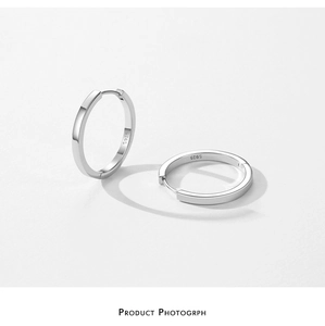 Detail view of S925 sterling silver hoop earrings featuring clear S925 engraved hallmarks