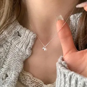 Minimalist s925 sterling silver chain with a freshwater pearl and silver bead pendant