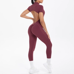 Detail view of wine red yoga jumpsuit featuring back hollow-out and scrunch butt design