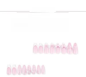 Detailed view of pink press-on nails with 3D bows, camellia flowers, and pearl accents