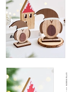 Handcrafted wooden penguin figurines for Christmas tabletop decor in a warm festive setting