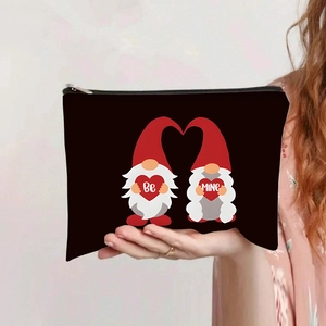 Detail of canvas makeup bag featuring Be Mine gnome print and durable metal zipper