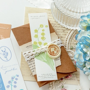 Vintage letterpress bookmarks with floral accents and wax seal for creative journaling