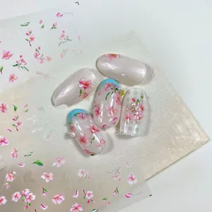 Détail de stickers à ongles fleurs de cerisier avec perles 3D et fini blanc nacré