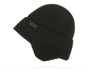 Detail of black knit beanie with fleece lining, ear protection, and SPORT label
