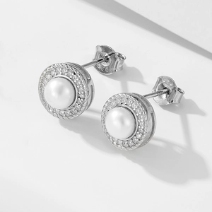 Close-up of S925 sterling silver stamp and micro-set zircons on pearl stud earrings