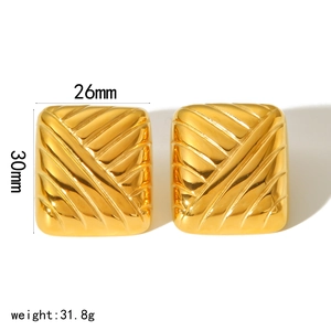 Detailed view of gold square earrings with texture and dimensions 26mm by 30mm
