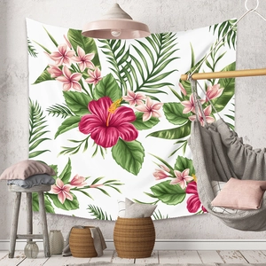Detail of tropical floral tapestry featuring hibiscus flowers and palm leaves on a wall
