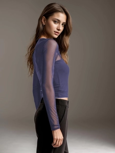 Detail of sheer purple mesh sleeve and tight fit on a chic long-sleeve top