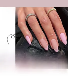 Detailed view of pink French style almond-shaped press-on nails and application effect