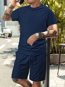 Detailed close-up of dark blue men sports set with waffle jacquard breathable texture