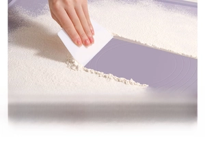 Detail of purple silicone baking mat with scraper showing easy clean non-stick surface