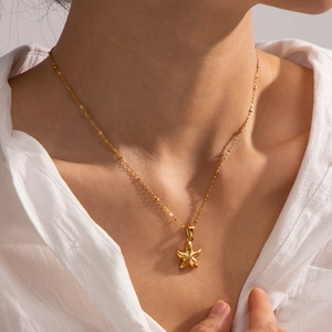 Elegant gold starfish pendant necklace with fine bead chain for beach vacation style