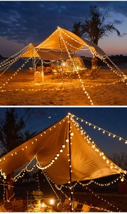 Warm white LED string lights decorating a beach camping tent at dusk for a cozy vibe