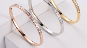 Detailed view of three-color minimalist bangles with rhinestone inlay and side clasp