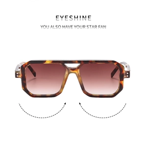 Detailed view of tortoiseshell double bridge aviator sunglasses with brown gradient lenses