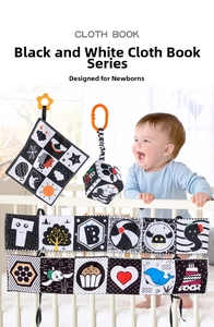Detail of high-contrast black and white cloth book set displayed on a baby crib